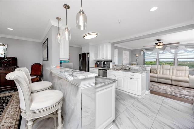 kitchen featuring black fridge, stainless steel dishwasher, kitchen peninsula, and white cabinets