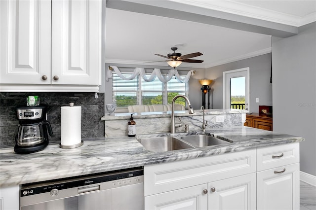 kitchen with sink, white cabinetry, stainless steel dishwasher, light stone countertops, and backsplash