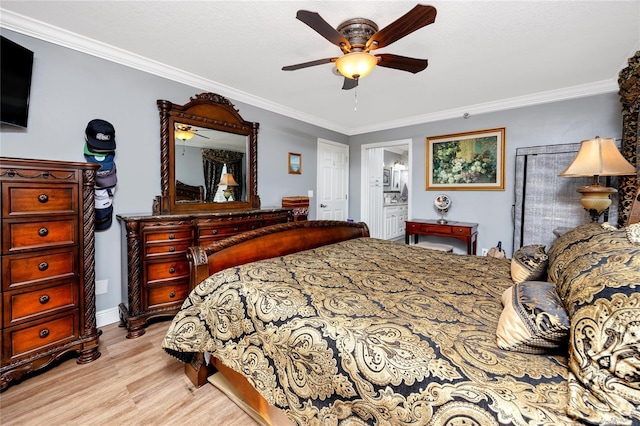 bedroom with ceiling fan, ornamental molding, connected bathroom, and light wood-type flooring