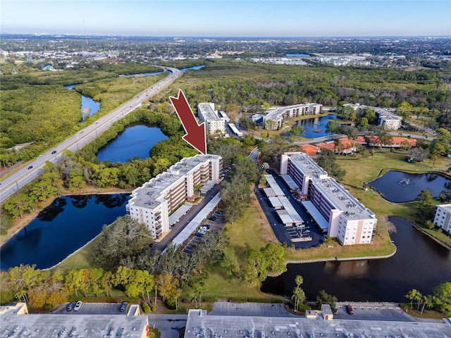 birds eye view of property featuring a water view