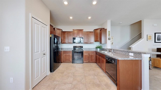 kitchen featuring black appliances, sink, light tile patterned floors, kitchen peninsula, and light stone countertops