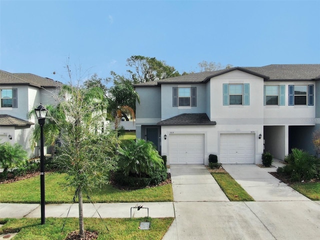 view of front of home featuring a garage and a front yard