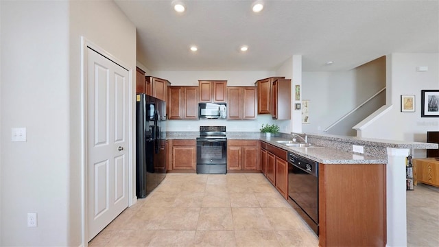 kitchen with recessed lighting, a sink, brown cabinets, a peninsula, and black appliances