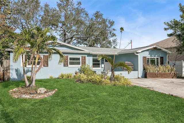 ranch-style home with a front lawn