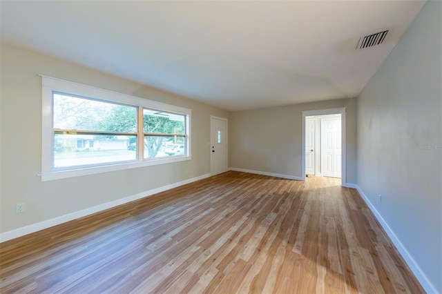 spare room featuring light hardwood / wood-style floors