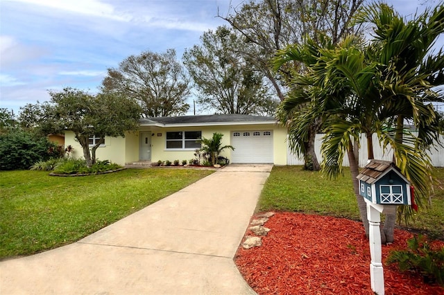 ranch-style home with a garage and a front yard