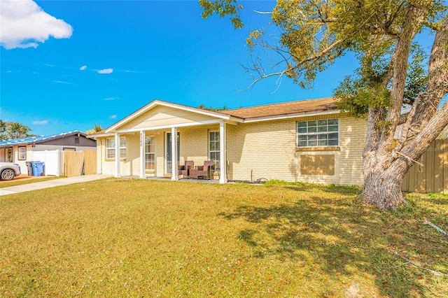 ranch-style house with a front lawn and a porch