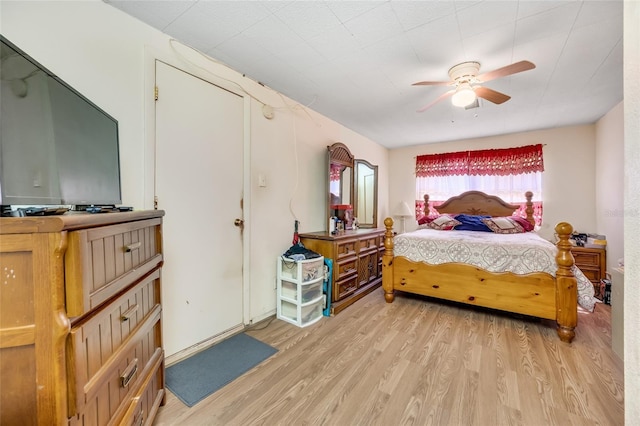 bedroom featuring ceiling fan and light wood-type flooring