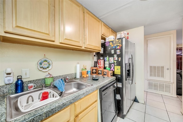 kitchen featuring light tile patterned flooring, black dishwasher, and light brown cabinets