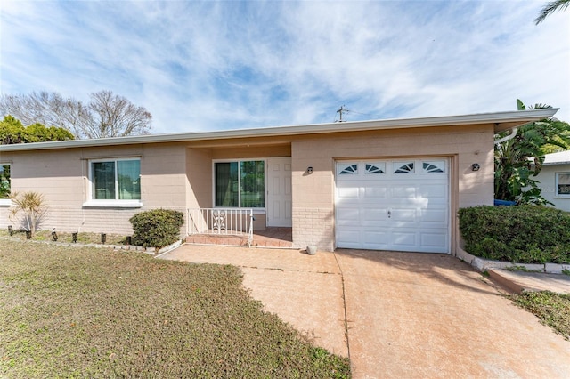 single story home featuring a garage, a front yard, and a porch