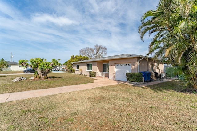 ranch-style house with a garage and a front lawn