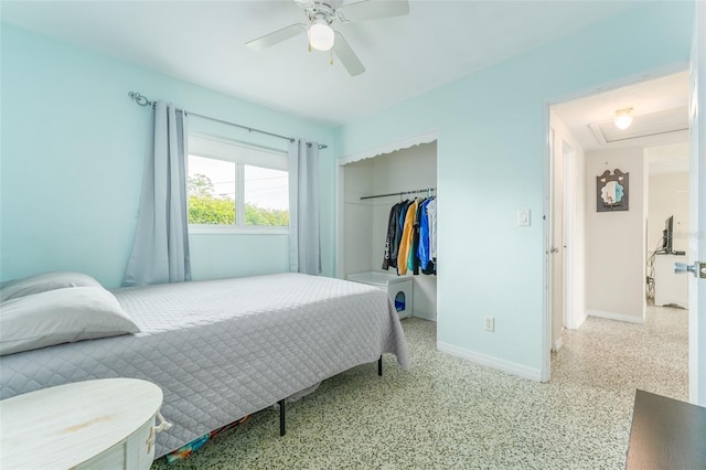 bedroom with ceiling fan and a closet