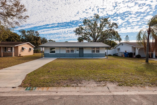 ranch-style home with a front lawn