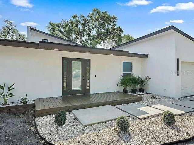 back of house with a garage