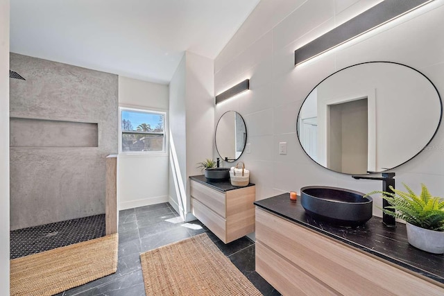 bathroom with walk in shower and vanity