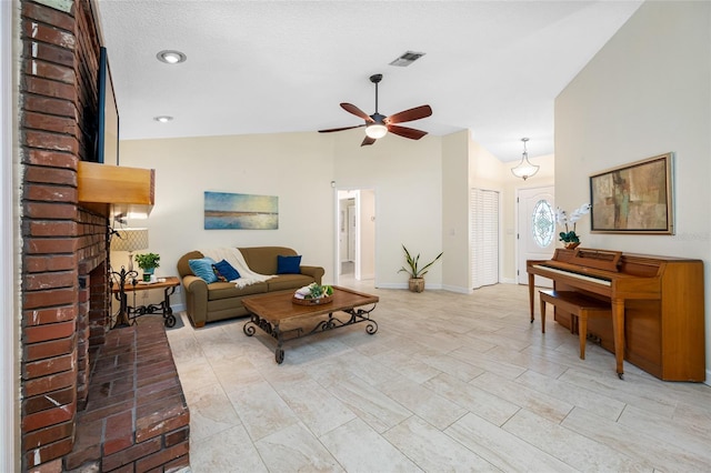 living room featuring vaulted ceiling, a brick fireplace, and ceiling fan