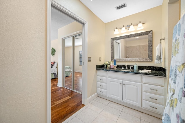 bathroom featuring vanity and tile patterned flooring