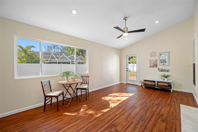 sitting room featuring dark wood-type flooring, ceiling fan, and vaulted ceiling