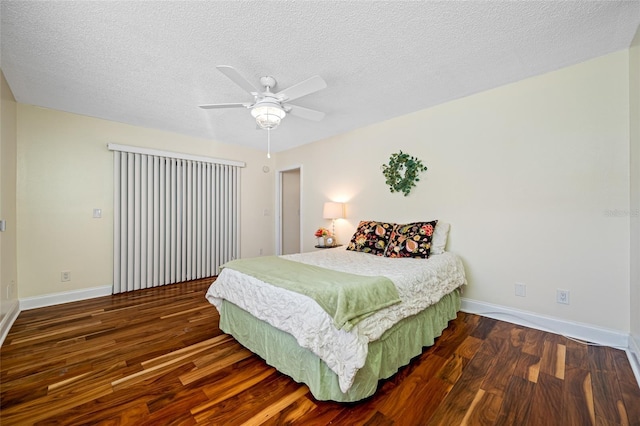 bedroom featuring ceiling fan, a textured ceiling, and dark hardwood / wood-style flooring