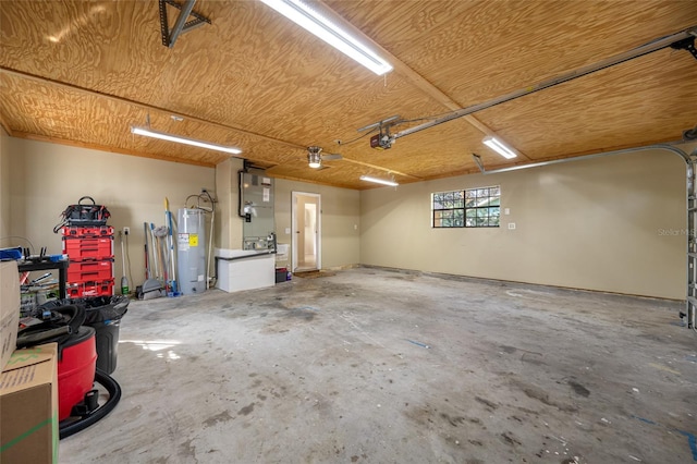 garage with a garage door opener and water heater