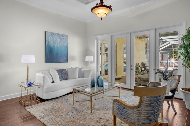 living room featuring crown molding, dark hardwood / wood-style floors, and french doors