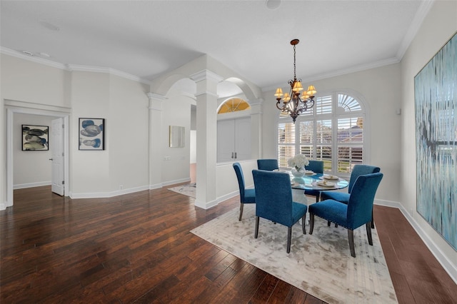 dining space with ornate columns, crown molding, dark wood-type flooring, and a chandelier