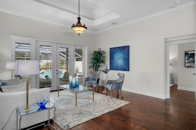 living room with dark wood-type flooring, ornamental molding, and a wealth of natural light