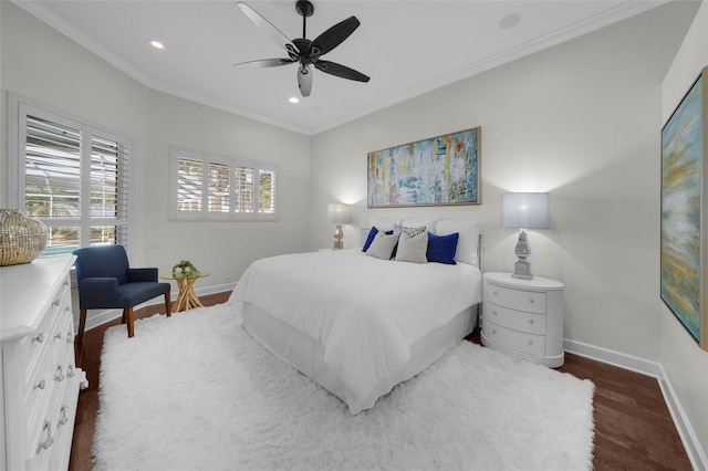 bedroom with ornamental molding, dark hardwood / wood-style floors, and ceiling fan