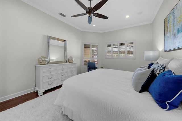 bedroom featuring crown molding, ceiling fan, and dark hardwood / wood-style floors