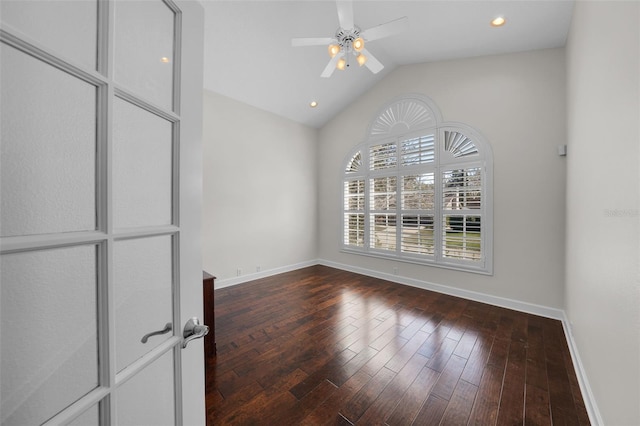 unfurnished room with lofted ceiling, wood-type flooring, and ceiling fan