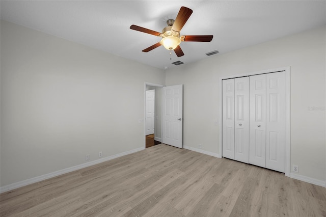 unfurnished bedroom featuring a closet, ceiling fan, and light hardwood / wood-style flooring