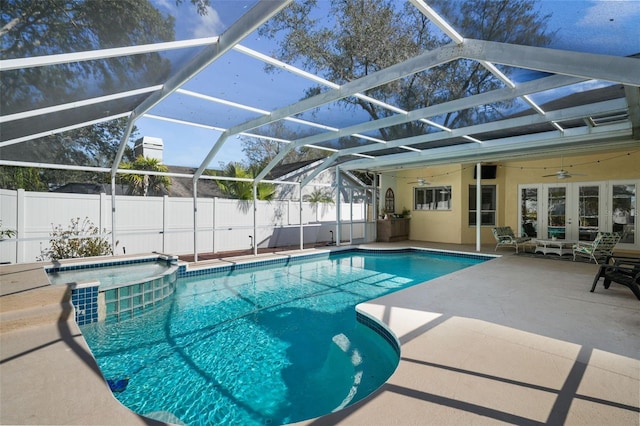 view of pool featuring a lanai, a patio area, french doors, and ceiling fan