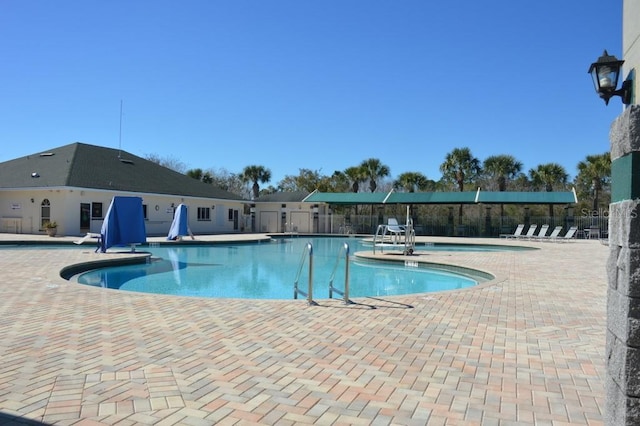 view of swimming pool featuring a patio area