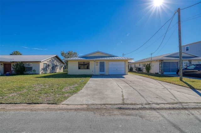 ranch-style house with a garage and a front lawn