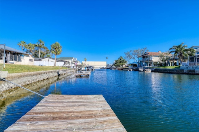 dock area with a water view