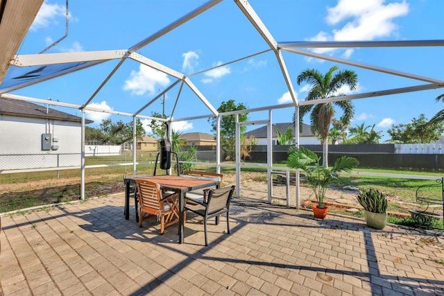 view of patio with glass enclosure