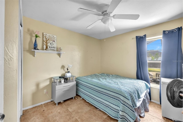 tiled bedroom with ceiling fan