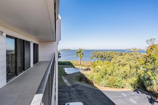 balcony featuring a water view