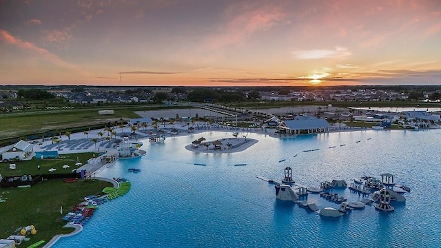 aerial view at dusk with a water view