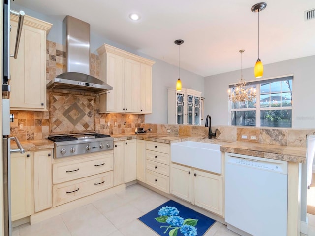 kitchen with wall chimney exhaust hood, hanging light fixtures, dishwasher, stainless steel gas stovetop, and backsplash