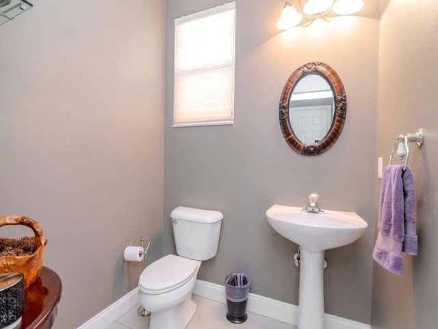 bathroom featuring tile patterned flooring and toilet