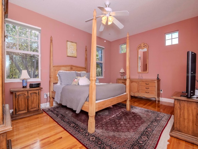 bedroom with hardwood / wood-style flooring and ceiling fan