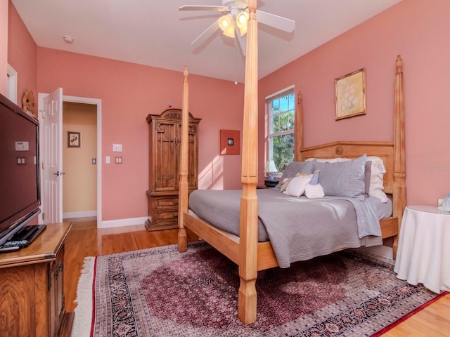 bedroom with hardwood / wood-style flooring and ceiling fan