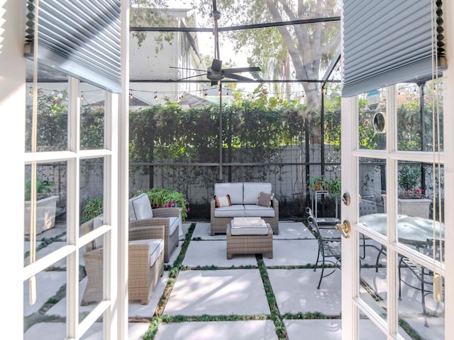 sunroom / solarium with ceiling fan