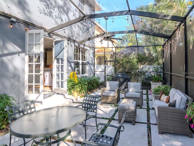 view of patio featuring an outdoor living space and a lanai