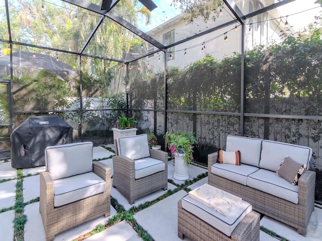 view of patio with an outdoor living space, a lanai, and a grill