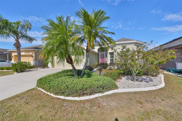 view of front of property with a garage and a front yard