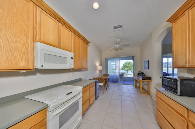 kitchen with ceiling fan, white appliances, a textured ceiling, and light tile patterned floors