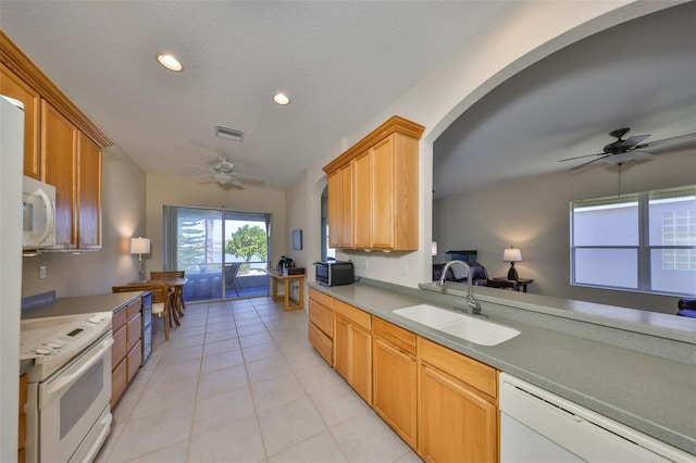 kitchen with sink, white appliances, a textured ceiling, light tile patterned floors, and ceiling fan