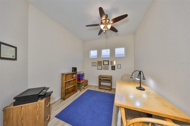 home office featuring ceiling fan and light wood-type flooring